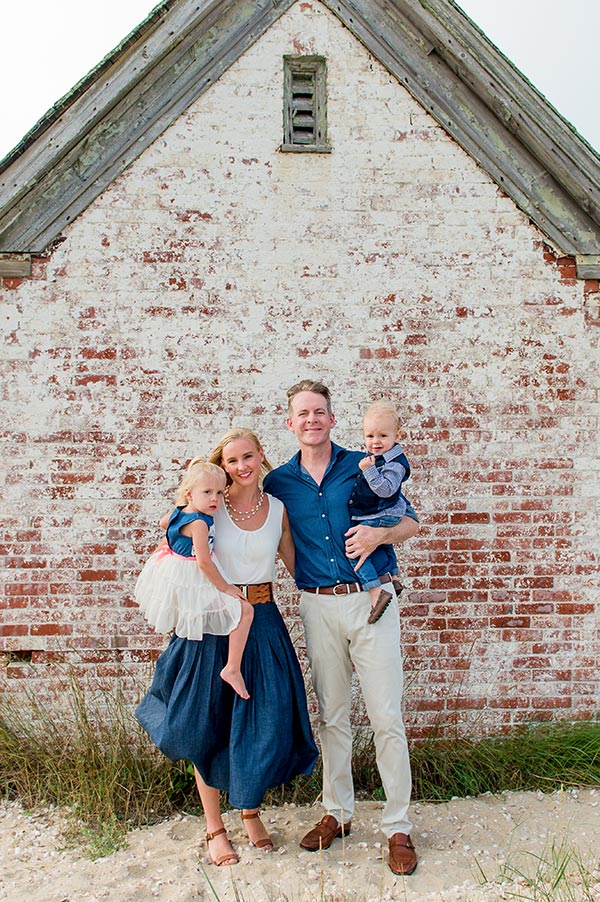 Family of 4 smiling at camera by Nantucket Family Photographer