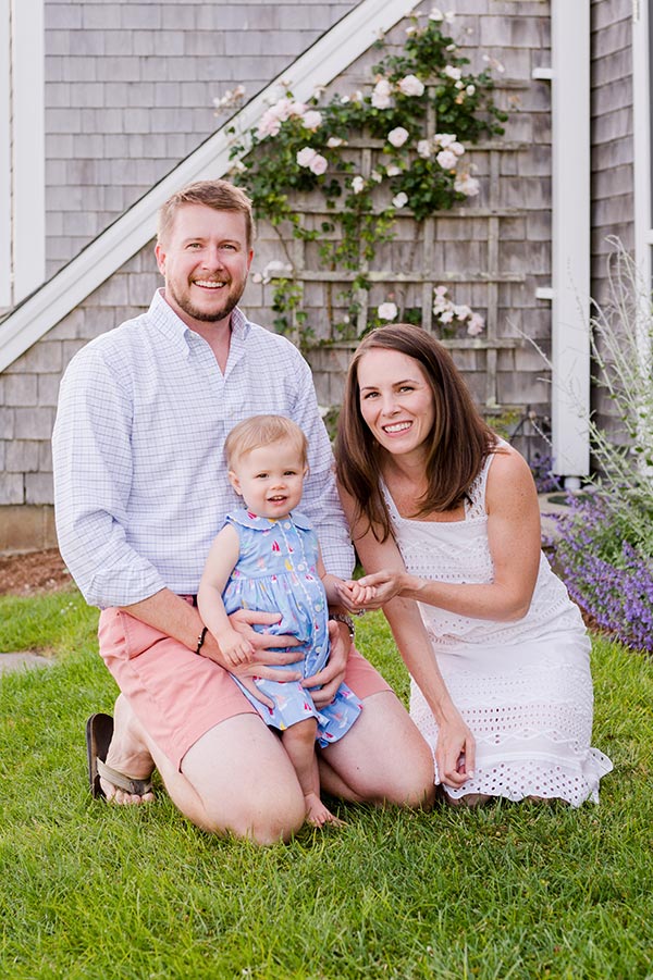 Family of 3 smiling at camera by Nantucket Family Photographer