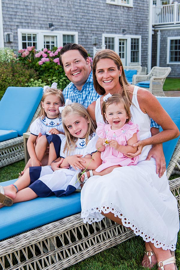 Family of 5 smiling at camera by Nantucket Family Photographer