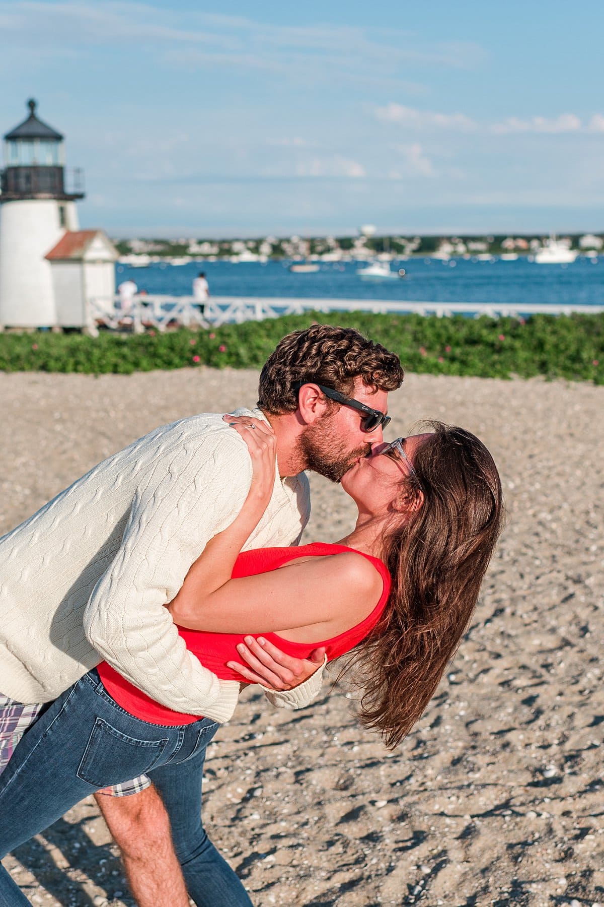 couple kissing on the beach at a Nantucket Proposal