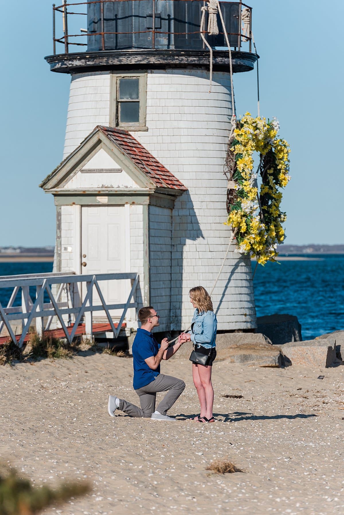 Nantucket Proposal in front of a lighthouse