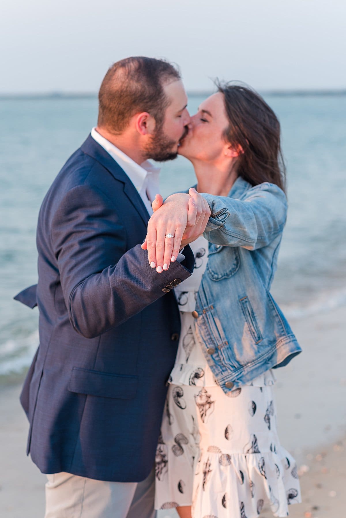 couple kissing showing off Nantucket Proposal ring